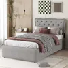 A bedroom scene featuring a bed with bedding, a nightstand with decor, and artwork on the wall. Anteprima dell’immagine prodotto