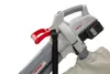 Close-up of a cordless leaf blower/vacuum/shredder with a collection bag attached. Produktbild-Vorschau