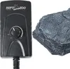 A black Repti-Zoo dimmer heat controller is shown next to a gray rock-like object, likely a reptile habitat accessory. Anteprima dell’immagine prodotto