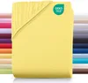 A folded yellow fitted sheet is shown with a stack of other colored sheets in the background. Produktbild-Vorschau