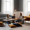 A family is playing a board game around a coffee table in a living room. Náhľad obrázku produktu