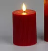 A close-up of a red LED candle with a flame. Produktbild-Vorschau