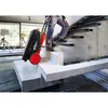 A person is pulling a tool case up a concrete staircase. Produktbild-Vorschau
