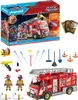 A Playmobil City Action fire truck playset is shown, including the box, the fire truck, figures, and accessories. Produktbild-Vorschau