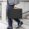 A person walking down stairs while carrying a laptop bag. Voir les images du produit