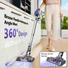 A person is using a cordless vacuum cleaner in a modern kitchen setting. Voir les images du produit