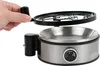 A person's hand is lifting the lid off a metal kitchen appliance. Produktbild-Vorschau
