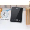 A digital scale is hanging on a hook on a wall, showcasing its hanging design. Náhľad obrázku produktu
