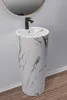 A pedestal sink with a black faucet is shown in a bathroom setting. Produktbild-Vorschau