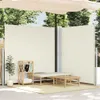 An outdoor patio scene with a retractable side awning, a bench, a coffee table, and a plant. Náhled obrázku produktu