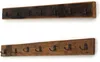 Two wooden coat racks with metal hooks mounted on a white background. Náhled obrázku produktu