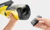 Hands inserting a battery into a Kärcher WV 5 Plus window vacuum cleaner. Náhľad obrázku produktu