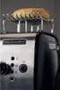 Close up of a toaster with a bun on top. Produktbild-Vorschau