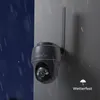 A security camera is mounted on a wall during a rain shower, with a solar panel visible. Produktbild-Vorschau