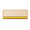 A single rectangular carpet mat with a beige top surface and a yellow and black stripe at the bottom, isolated on a white background. Náhled obrázku produktu