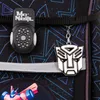 Close-up of a backpack with a keychain and a reflective strip. Produktbild-Vorschau