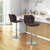 Two brown bar stools in a kitchen setting with a counter and tiled backsplash. Produktbild-Vorschau