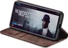 A brown flip case for a smartphone, displaying a movie poster on the phone screen. Produktbild-Vorschau