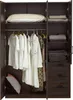 An open wardrobe with clothes hanging and folded items on shelves. Produktbild-Vorschau