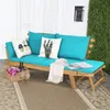 An outdoor patio scene featuring a wooden sofa with blue cushions and decorative pillows. Anteprima dell’immagine prodotto