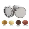 A stainless steel shaker with a mesh lid and four small piles of powders below, labeled 'Pepper', 'Corn flour', 'Chocolate powder', and 'Cocoa powder'. Produktbild-Vorschau