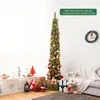 A decorated artificial Christmas tree stands in a living room setting with gifts and decorations. Podgląd zdjęcia produktu