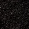 A close-up view of a black shaggy rug. Produktbild-Vorschau