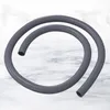 A gray flexible hose coiled on a marble-like surface. Produktbild-Vorschau
