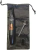 A black precision trimmer with a copper accent, a small brush, and a black drawstring bag are laid out on a white background. Podgląd zdjęcia produktu