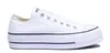 A white Converse sneaker with a platform sole is shown against a white background. Voir les images du produit