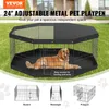 A golden retriever dog is lying inside a black metal pet playpen set up on a grassy lawn. Anteprima dell’immagine prodotto
