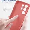 A hand is touching a red phone case, highlighting its matte surface and soft grip. Produktbild-Vorschau