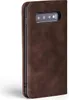 A close-up side view of a brown leather flip case for a smartphone. Produktbild-Vorschau