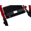 A close-up view of a black LED work light mounted on red metal legs. Produktbild-Vorschau