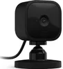 A black Blink Mini smart plug-in security camera is shown on a white background, mounted on a small black base with a cable extending to the left. Podgląd zdjęcia produktu