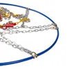 A close-up view of a snow chain for a car tire, showing its metallic links and blue rim. Produktbild-Vorschau