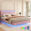 A pink upholstered bed with LED lighting in a bedroom setting.