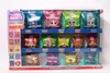 A display box containing multiple individually wrapped candy packs, each featuring a doll character. Produktbild-Vorschau