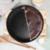 A chocolate cake is shown in a springform pan, with half of the cake covered in chocolate glaze. Náhled obrázku produktu