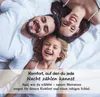 A family lying on a bed, smiling. Produktbild-Vorschau