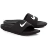 A pair of black Nike Kawa slide sandals for children, shown from a slightly elevated side angle against a white background. Podgląd zdjęcia produktu