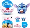 A collage of ZURU Snackles Disney toys, including a plush Stitch, a surprise ball, and packaging. Produktbild-Vorschau