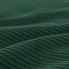 A close-up, abstract view of a dark green corduroy fabric with a wavy, rippled texture. Produktbild-Vorschau