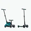 Two teal and black scooters are shown against a white background. One is in a ride-on configuration with a seat and parent handle, and the other is in a standing scooter configuration. Voir les images du produit