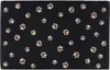 A black rug with a pattern of beige paw prints. Produktbild-Vorschau