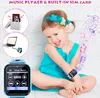 A young girl wearing a blue dress and a blue smartwatch, sitting in front of a white brick wall, with musical notes graphics on the side. Produktbild-Vorschau