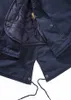 A close-up view of the interior of a navy blue parka jacket, showing the lining, zipper, and drawstrings. Náhled obrázku produktu
