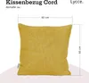 A yellow corduroy cushion cover with dimensions indicated. Produktbild-Vorschau