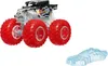 A Hot Wheels Monster Truck toy with red wheels and a transparent body, shown with a small blue ice-like accessory. The truck has black detailing with lightning bolt graphics and the Hot Wheels logo. Produktbild-Vorschau
