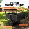 A black garden trailer is shown in an outdoor setting with buildings and trees in the background. Text overlays highlight product features. Produktbild-Vorschau